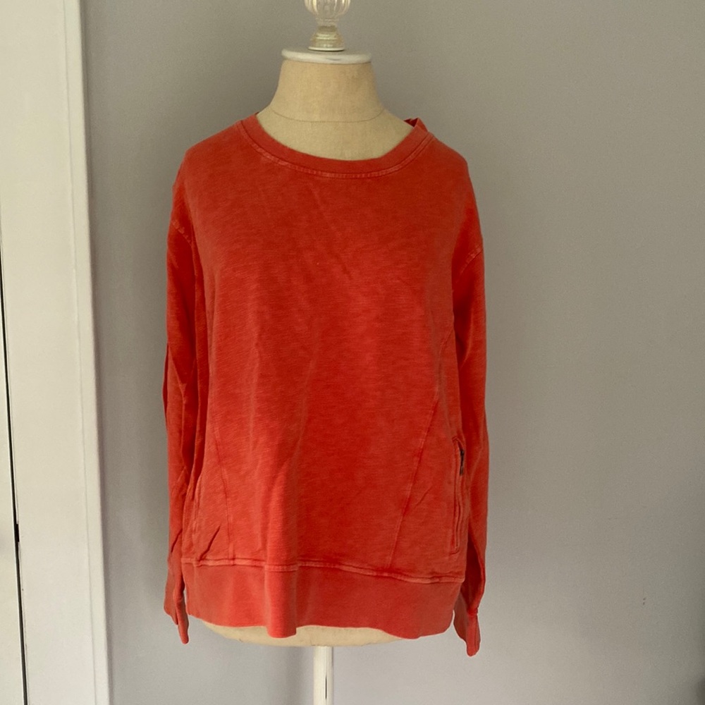Made to look sun faded pretty peachy orange Orvis sweatshirt